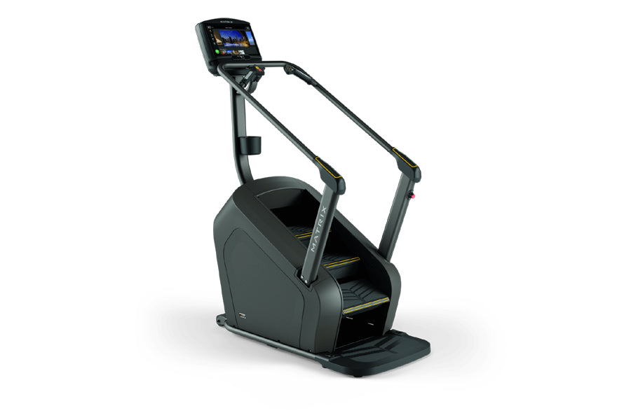Matrix C50 Climbmill with digital display screen, black frame, and yellow accent details on footplate, shown on white backgro