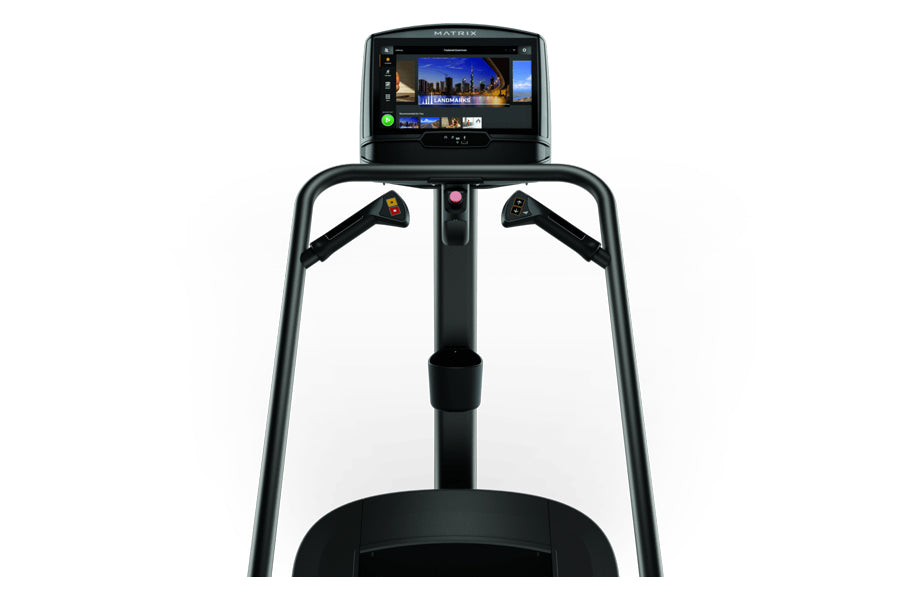 Black Matrix C50 Climbmill with digital display screen showing fitness content and dual handrails, front view on white backgr