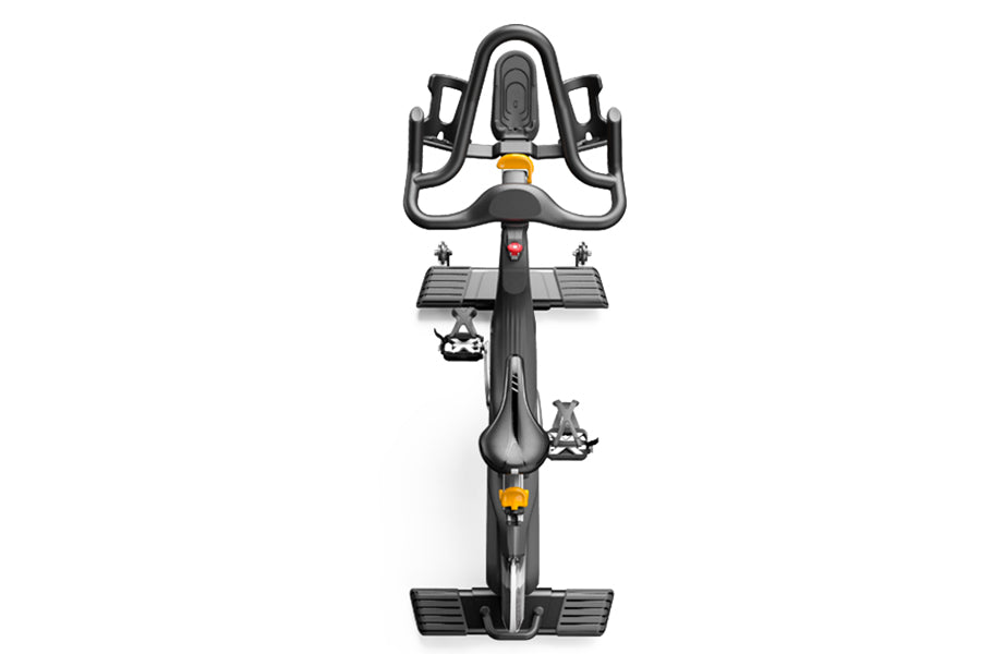 Matrix CXC indoor training stationary bike with gray handlebar, black frame, and yellow accent details, shown from front view