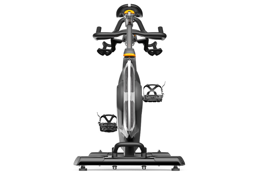 Matrix CXC indoor training bike with gray frame, black drop handlebars, and yellow accent details, shown from front view on w