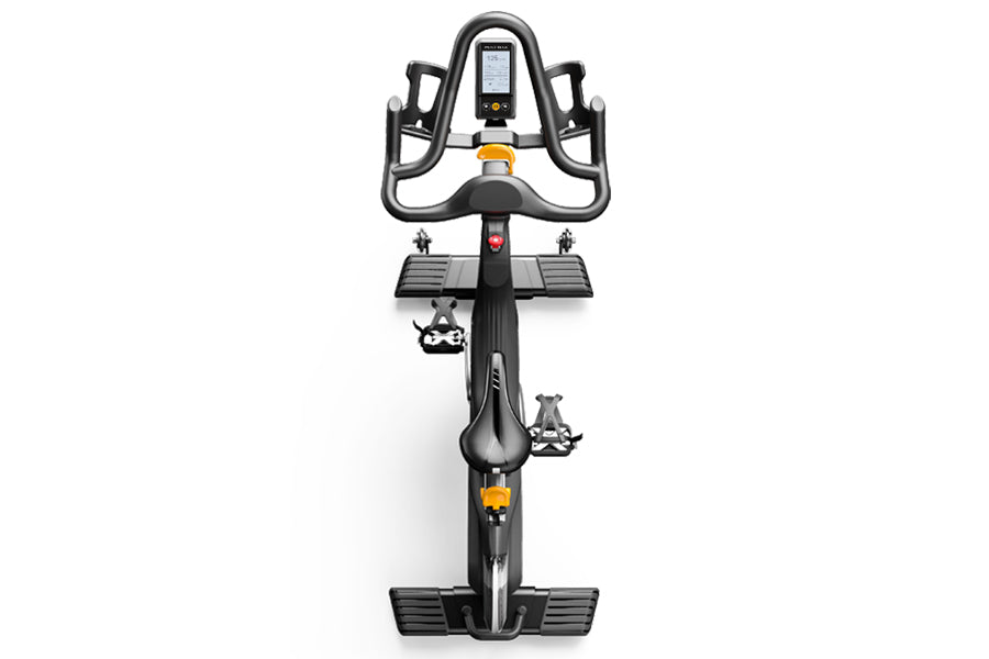 Matrix CXM indoor training cycle with black frame, digital display console, curved handlebar grips, and dual platform pedals 