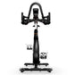 Black and white stationary indoor cycling bike with curved handlebars, digital display, and pedals shown from front view on w