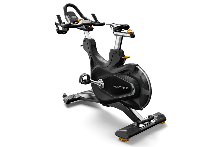 Matrix CXP black indoor training cycle with curved seat, handlebars, and yellow accents on white background
