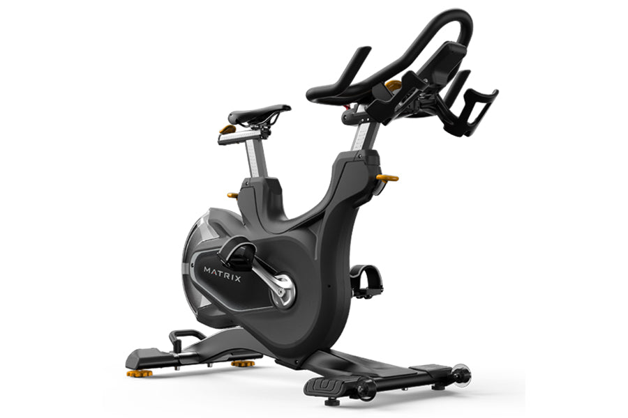 Matrix CXP indoor training cycle with black frame, gray accents, adjustable seat and handlebars on white background