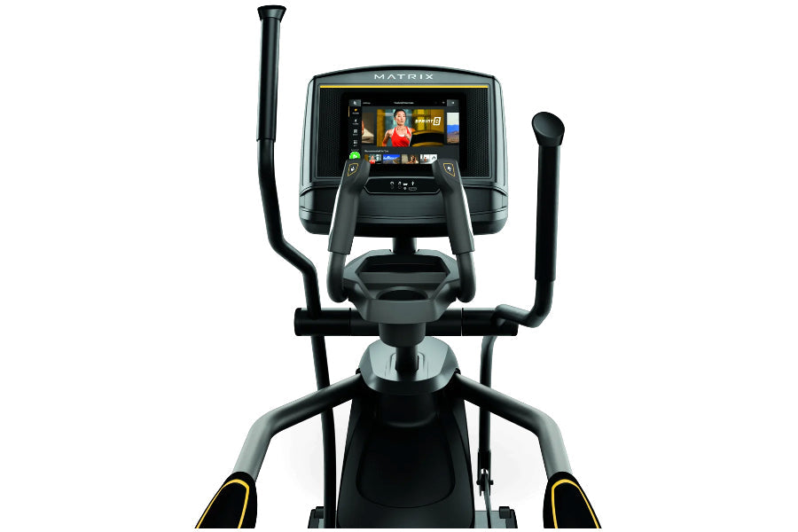 Matrix E30 elliptical machine with digital touchscreen display, black frame, dual handlebar arms, and foot pedals on white ba