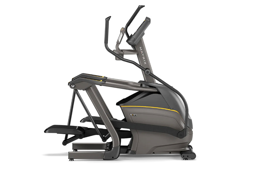 Black and gray Matrix E30 elliptical machine with yellow accent stripe, dual handles, and wide footplates on white background
