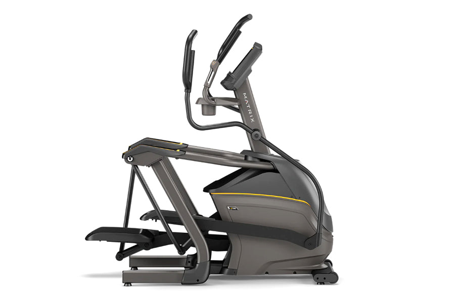 Matrix E50 elliptical machine with black frame, yellow accent stripe, dual handles, and moving footpedals on white background