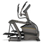 Matrix E50 elliptical machine with black frame, dual handles, and footpleds on white background