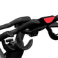 Black and red stationary indoor cycling bike with padded seat, curved handlebars, and adjustable resistance, shown on white b