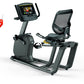 Matrix R30 recumbent exercise bike with black mesh seat back, gray frame, digital display console, and red sale tag on white 