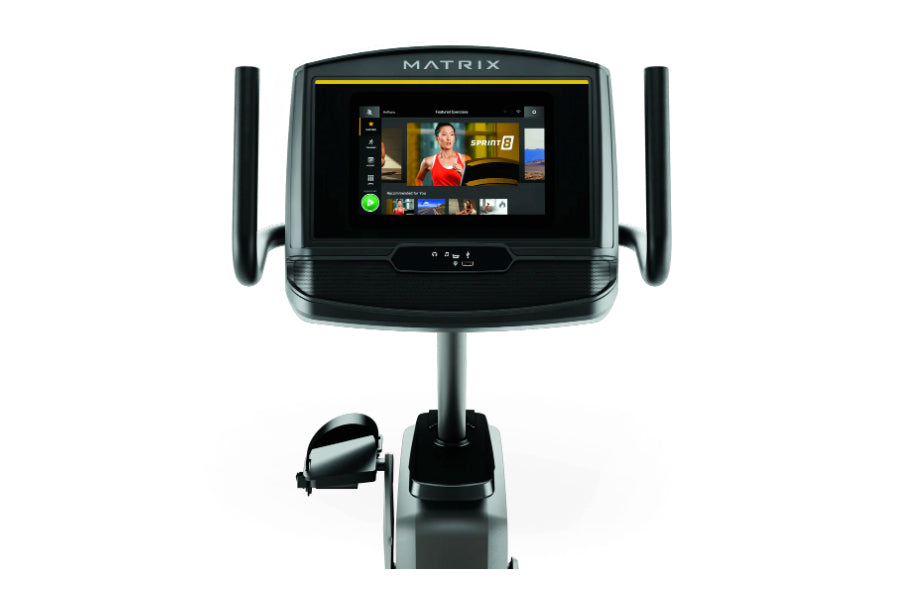 Matrix R30 recumbent exercise bike with touchscreen display, black frame, and dual handles on white background