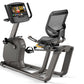 Matrix R30 recumbent exercise bike with black mesh seat back, gray frame, digital display console, and foot pedals on white b