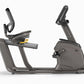 Matrix R30 recumbent exercise bike with black frame, padded seat, handlebar grips, and digital console on white background