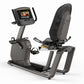 Matrix R50 recumbent exercise bike with black mesh backrest and gray frame, digital touchscreen console on adjustable arm, on