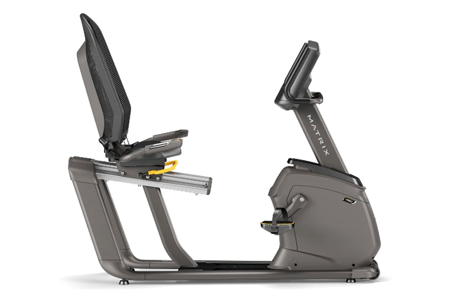 Matrix R50 recumbent exercise bike with gray frame, black padded seat, and digital display on white background