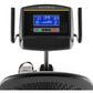 Matrix R50 recumbent exercise bike with blue LCD display showing workout metrics, black frame, dual handles, and seat on whit