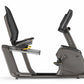 Matrix R50 recumbent exercise bike with gray frame, black mesh seat, and digital display console on white background