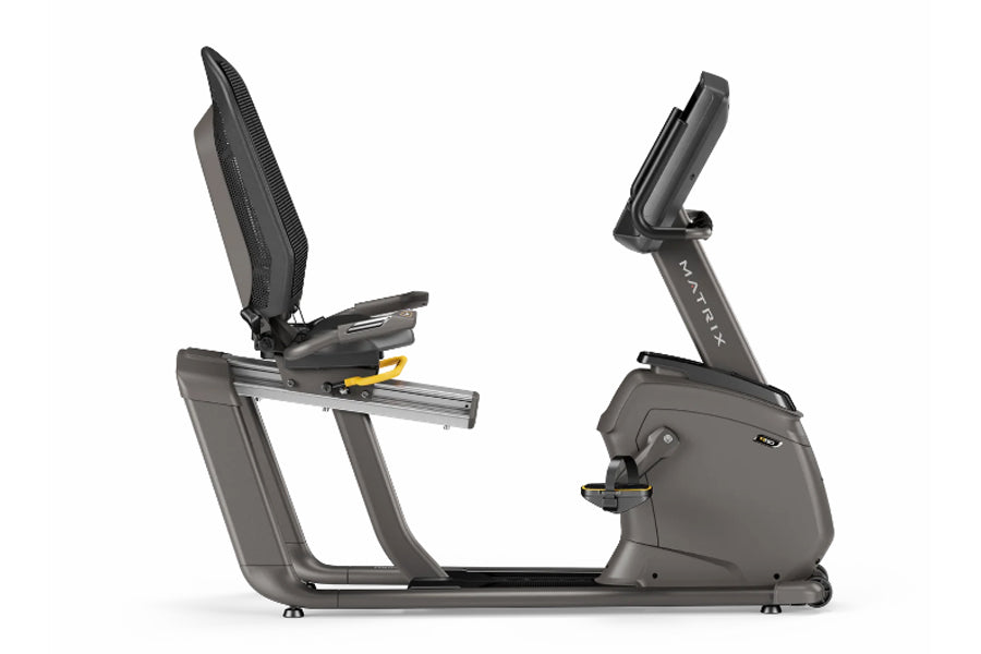 Matrix R50 recumbent exercise bike with gray frame, black mesh seat, and digital display console on white background