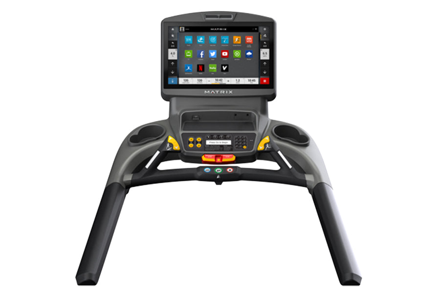 Matrix T130 treadmill with black frame, touchscreen console displaying app icons, and yellow accent buttons on handlebars, fr