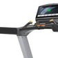 Matrix T130 treadmill with black cushioned running belt, gray frame, and digital display console showing active workout metri