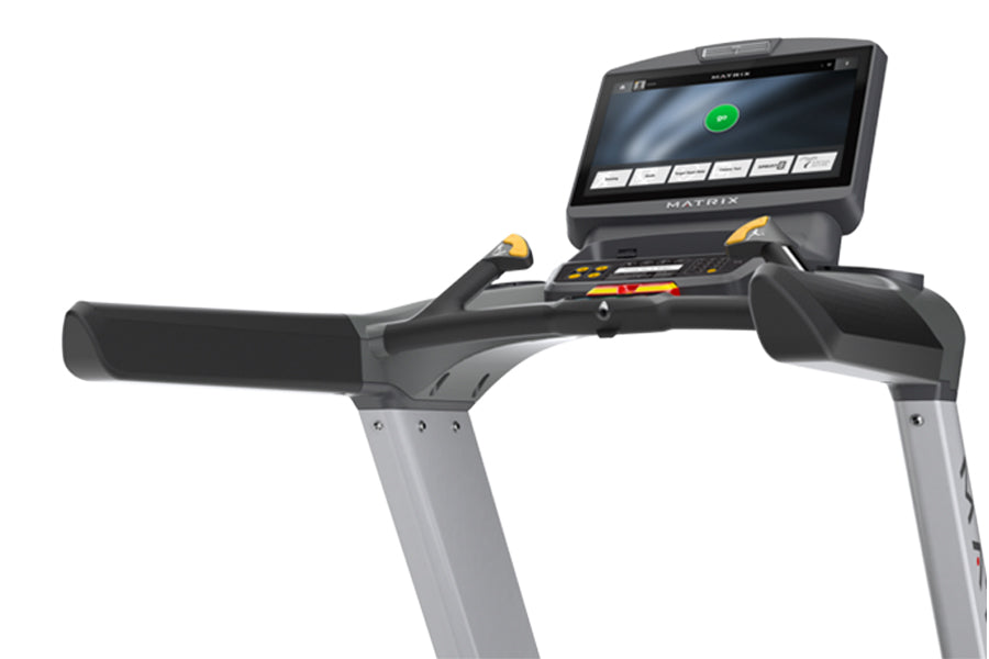 Matrix T130 treadmill with black cushioned running belt, gray frame, and digital display console showing active workout metri