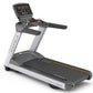 Matrix T130 treadmill with black running deck, silver frame, digital console with buttons and display, black handrails, on wh