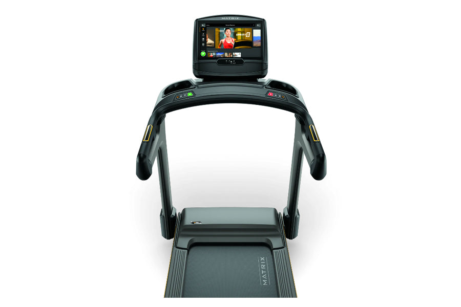 Matrix T30 treadmill with black frame, digital console displaying workout metrics, and illuminated control buttons, viewed fr