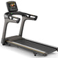 Matrix T50 treadmill with black frame, gray accents, digital display console, and gold trim on white background