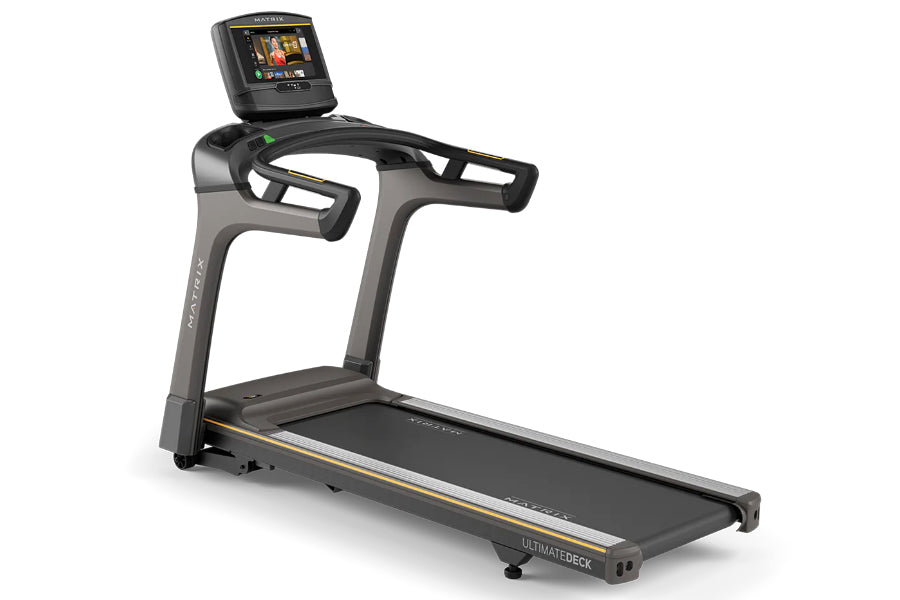 Matrix T50 treadmill with black frame, gray accents, digital display console, and gold trim on white background