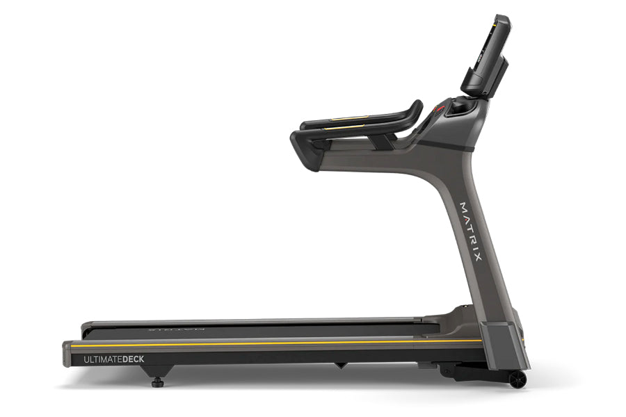 Matrix T50 black treadmill with gray frame and yellow accents, featuring digital display and upright console, shown from side