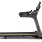 Matrix T50 black treadmill with gray frame and yellow accents, featuring digital display and upright console, shown from side