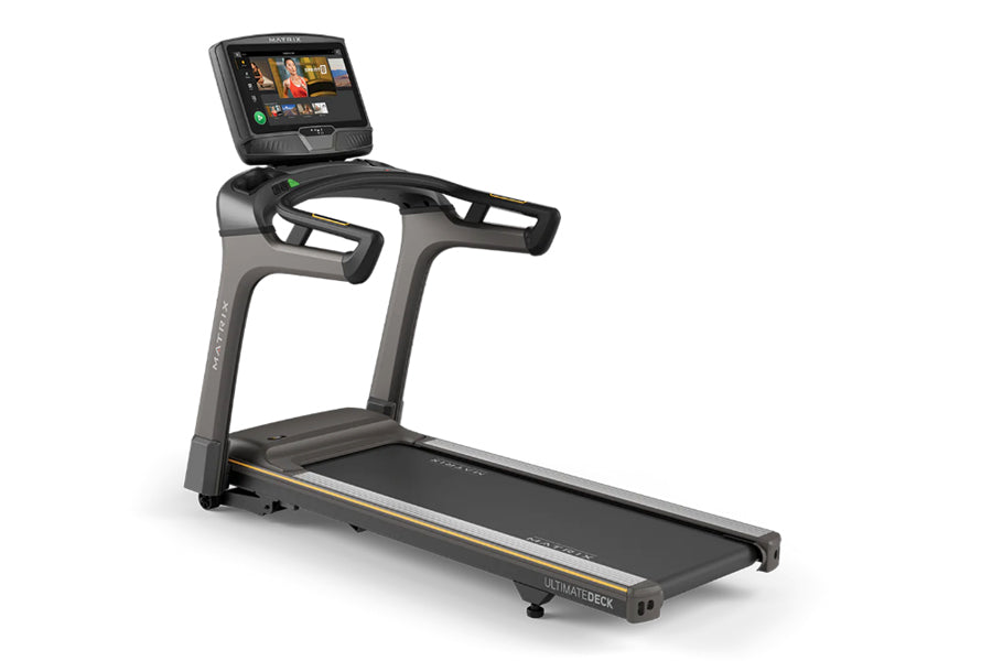 Matrix T50 treadmill with black running deck, gray frame, and digital touchscreen console on white background