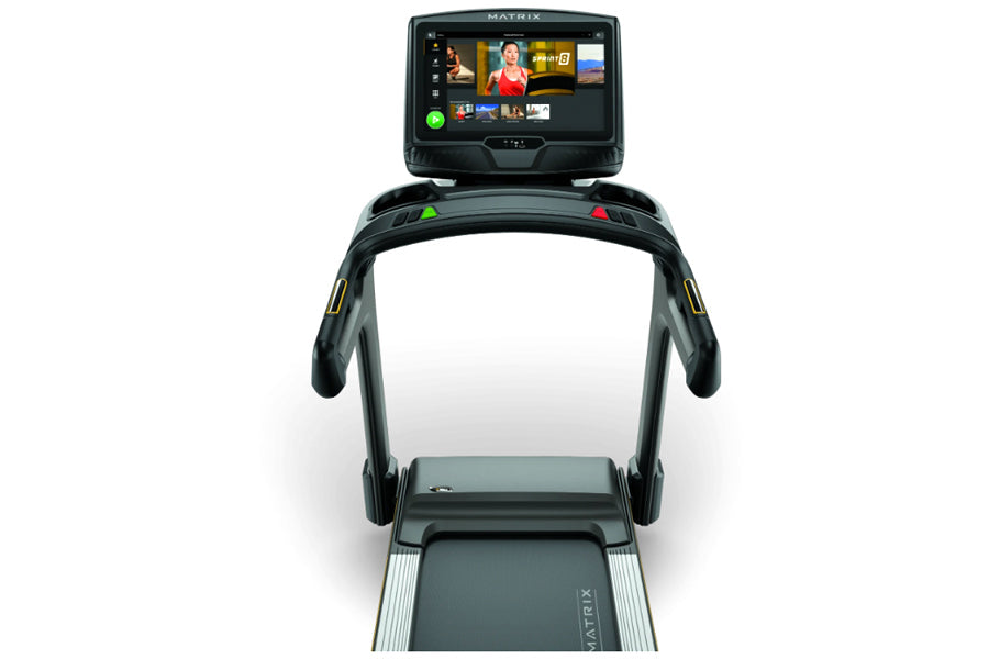Matrix T50 treadmill with black frame, dual handles, and digital touchscreen display showing workout interface on white backg