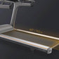 Matrix T75 treadmill with gray frame, black running deck with grid pattern, and digital display showing 60" by 22" dimensions