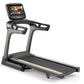 Matrix TF50 folding treadmill with black and gray frame, digital touchscreen console, and black running deck on white backgro