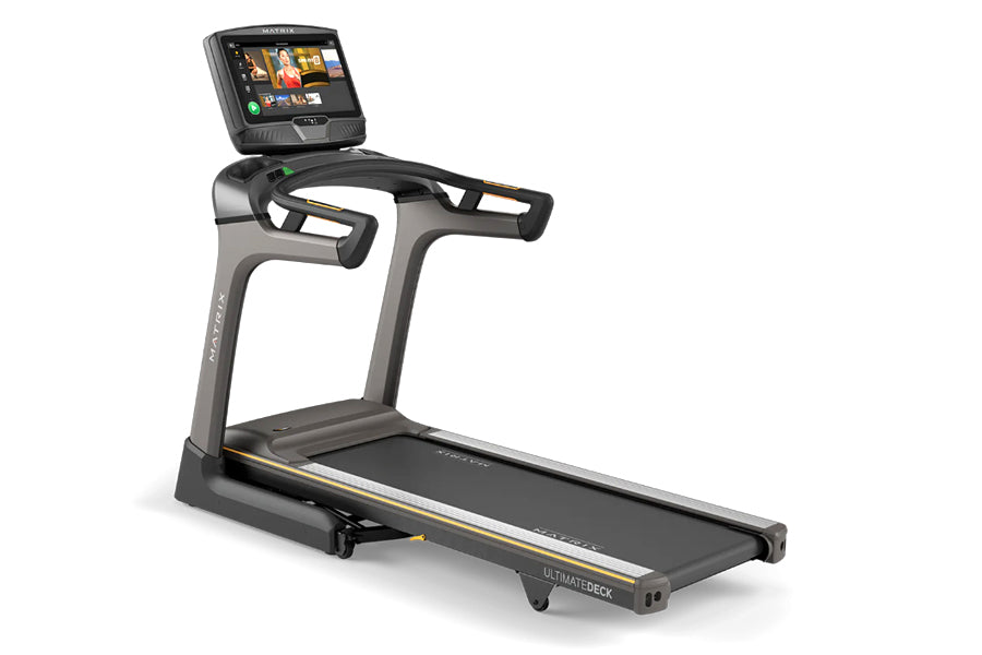 Matrix TF50 folding treadmill with black and gray frame, digital touchscreen console, and black running deck on white backgro
