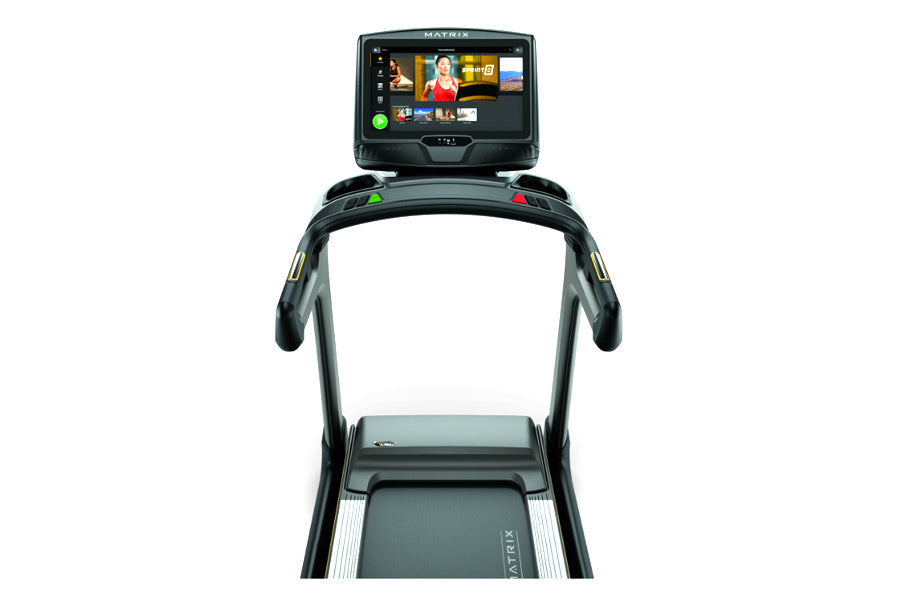Matrix TF50 folding treadmill with black frame, touchscreen display showing workout content, and gray running deck on white b