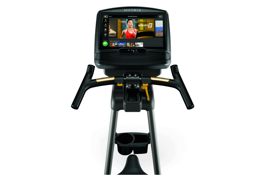 Matrix U30 upright exercise bike with black frame, yellow accents, and touchscreen display showing fitness content, front vie