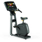 Matrix U50 upright exercise bike with gray frame, black seat, and digital display console on white background