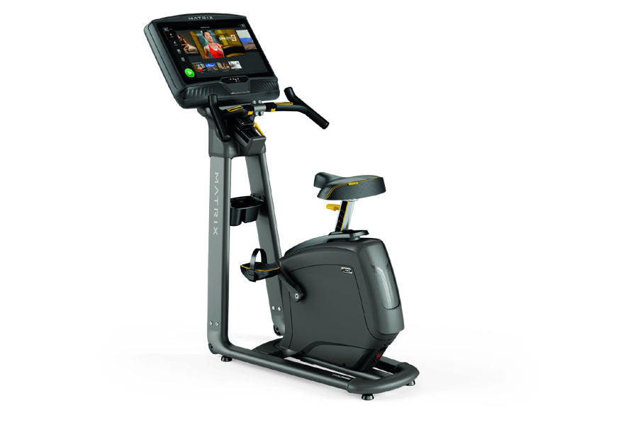 Matrix U50 upright exercise bike with gray frame, black seat, and digital display console on white background