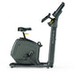 Matrix U50 upright exercise bike with black frame, padded seat, and digital display console on white background