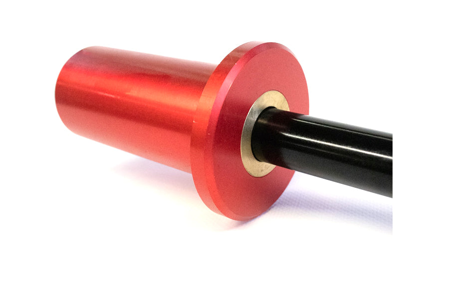Warrior Mini Olympic Barbell with bright red cylindrical sleeves, black steel bar, and metal collar on white background