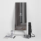 Lululemon Studio Mirror Plus with black frame standing upright, displaying studio reflection, surrounded by accessories inclu