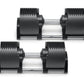 Pair of black adjustable dumbbells with ribbed rubber weight plates and silver metal handles, shown on white background