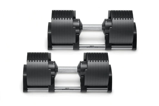 Pair of black adjustable dumbbells with ribbed rubber weight plates and silver metal handles, shown on white background