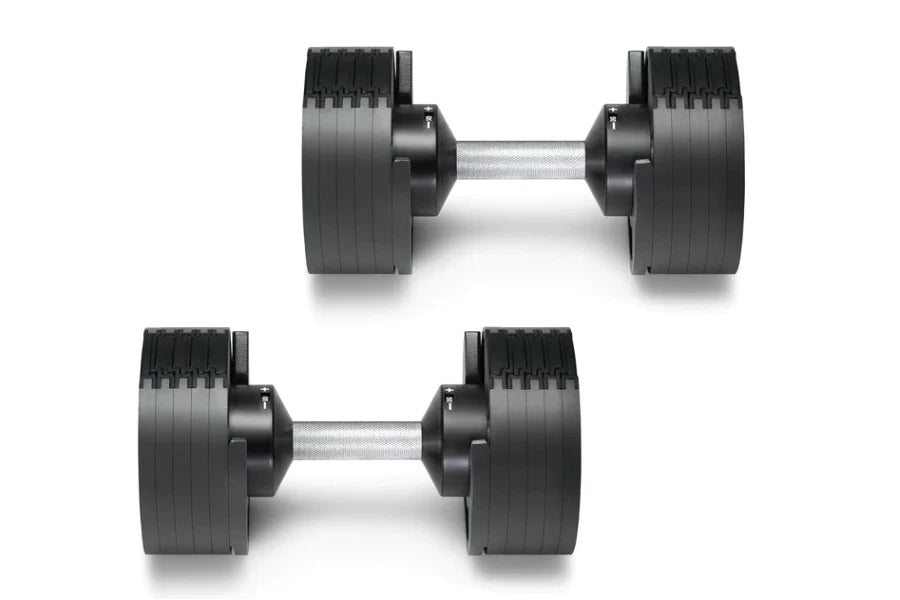 Pair of black NÜOBELL adjustable dumbbells with silver handles and weight plates, shown on white background