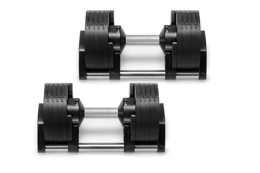 Pair of NÜOBELL adjustable dumbbells with black rubber-coated weight plates and silver metal handles on white background