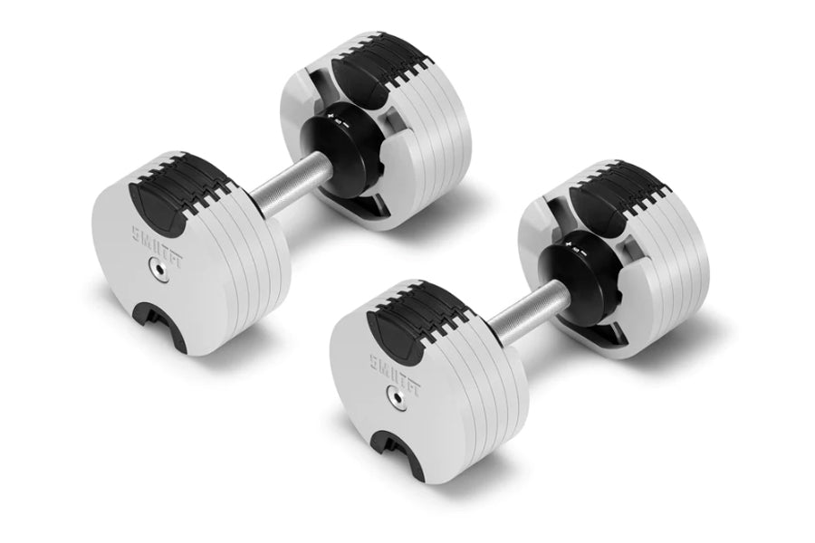Pair of white and black adjustable dumbbells with metal handles on white background