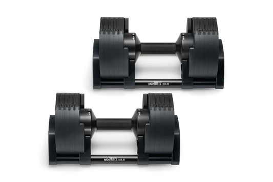 Pair of black adjustable dumbbells with textured grip handles and silver center bars, shown from side view on white backgroun