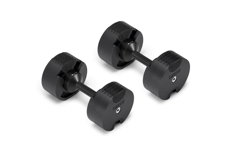 Pair of black matte adjustable dumbbells with textured grip handles and weight markings, displayed on white background